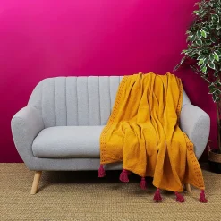 Jeté de canapé surpiqué pompons jaune 130x150 cm><noscript><img width=