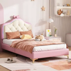 Lit enfant simple 90x200 cm rembourré avec bande LED colorée, tête ondulée et nœud décoratif, similicuir rose sans matelas><noscript><img width=