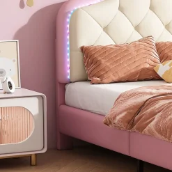 Lit enfant simple 90x200 cm rembourré avec bande LED colorée, tête ondulée et nœud décoratif, similicuir rose sans matelas><noscript><img width=
