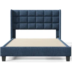 Lit 140x200 cm avec tête de lit tapissée en lin bleu, pieds noirs et sommier à lattes intégré, design élégant><noscript><img width=